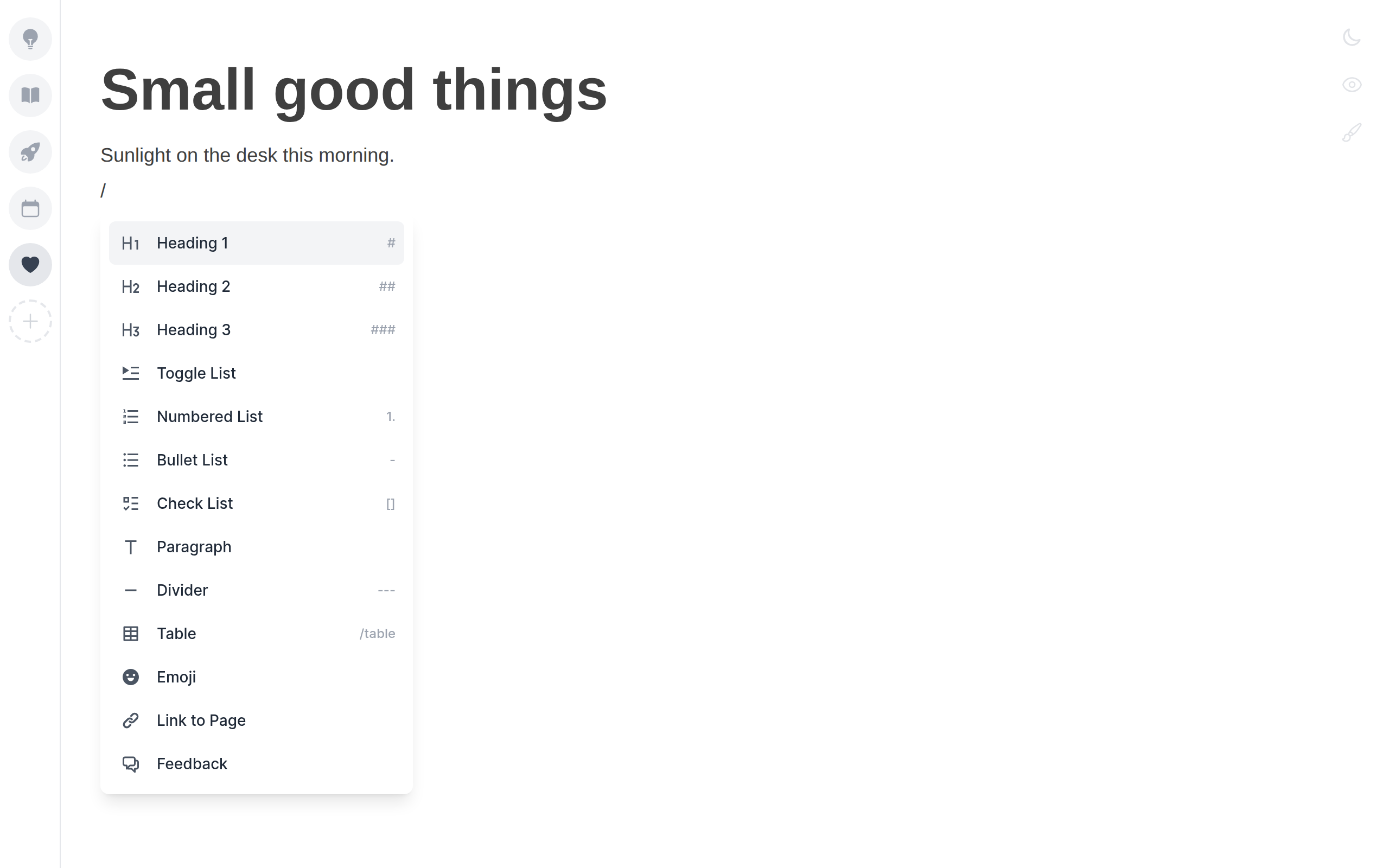 The slash command menu listing headings, lists, check list, divider, table and emoji